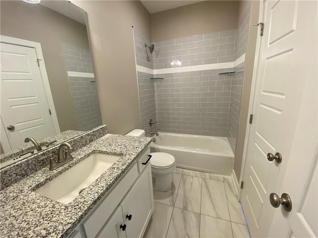 full bathroom with tiled shower / bath combo, oversized vanity, toilet, and tile floors