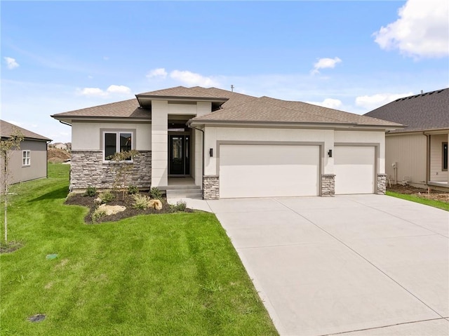 prairie-style house with a garage and a front lawn