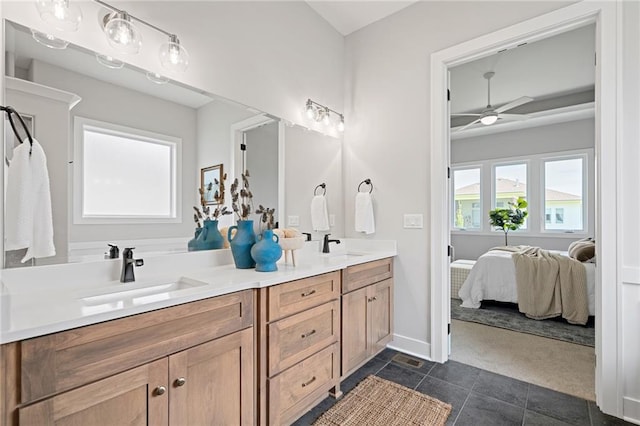 bathroom featuring tile patterned floors, ceiling fan, and vanity