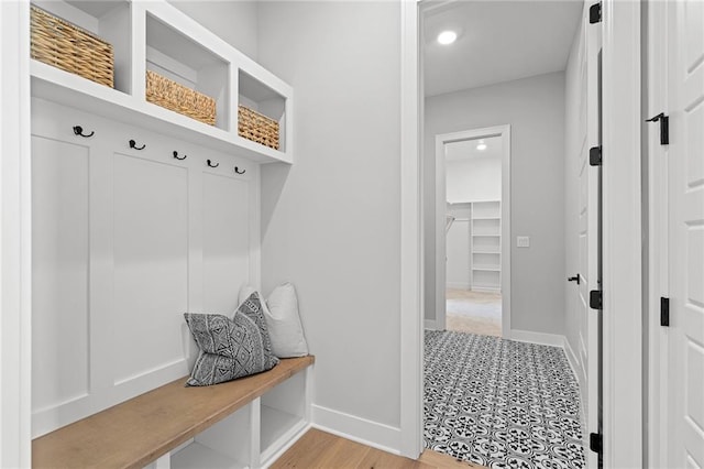 mudroom with light hardwood / wood-style flooring