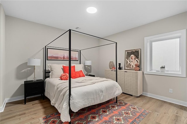 bedroom with light hardwood / wood-style floors