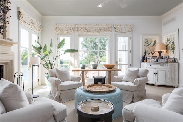 tiled living room featuring ornamental molding and ceiling fan