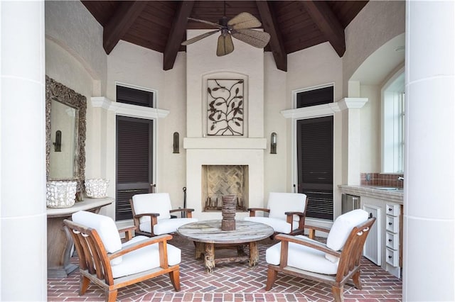 sitting room with high vaulted ceiling, ceiling fan, and wooden ceiling