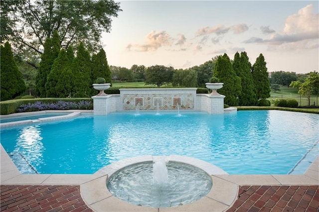 view of swimming pool featuring pool water feature