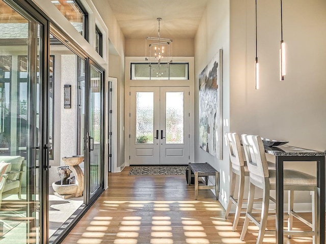 2908 NE 102nd St, Kansas City, MO 64155 - foyer featuring a notable chandelier, french doors, and hardwood / wood-style flooring