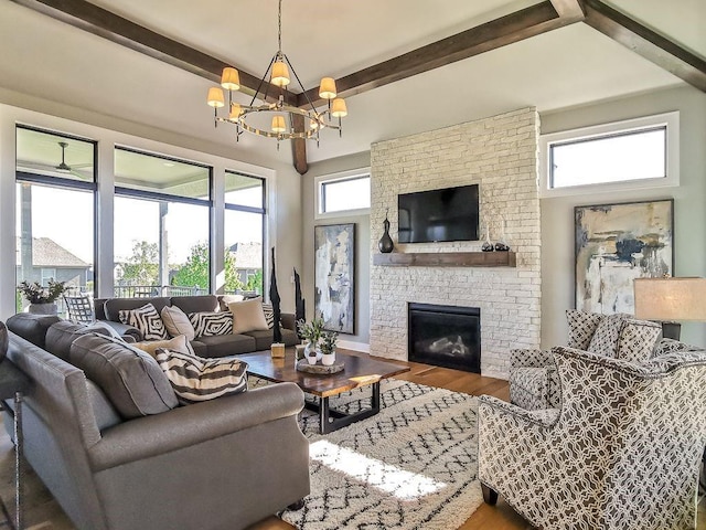 2908 NE 102nd St, Kansas City, MO 64155 - living room with a chandelier, beam ceiling, hardwood / wood-style flooring, and a fireplace