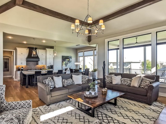 2908 NE 102nd St, Kansas City, MO 64155 - living room with an inviting chandelier, beam ceiling, and dark hardwood / wood-style flooring