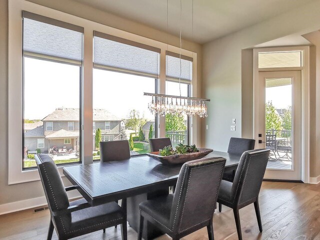 2908 NE 102nd St, Kansas City, MO 64155 - dining space featuring an inviting chandelier and light wood-type flooring