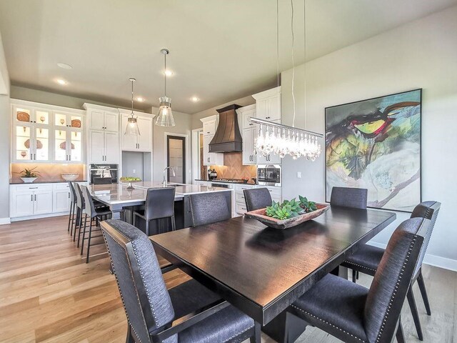 2908 NE 102nd St, Kansas City, MO 64155 - dining space with light hardwood / wood-style flooring and sink
