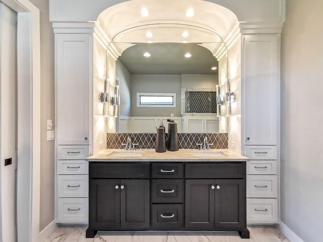 2908 NE 102nd St, Kansas City, MO 64155 - bathroom with dual sinks, oversized vanity, and tasteful backsplash