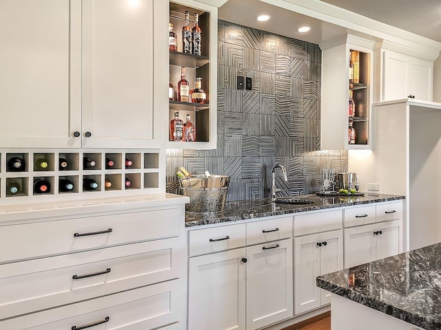 2908 NE 102nd St, Kansas City, MO 64155 - bar with backsplash, white cabinets, and dark stone countertops