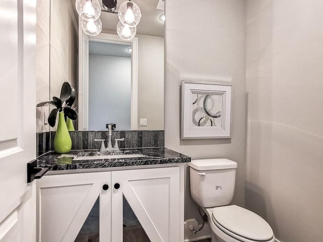 2908 NE 102nd St, Kansas City, MO 64155 - bathroom featuring toilet, a chandelier, and vanity