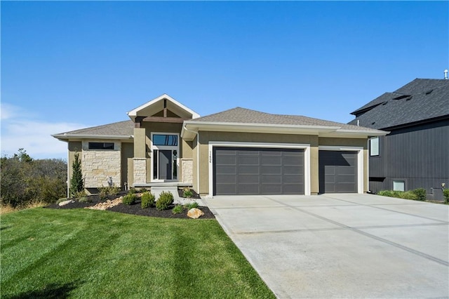 11606 S Zarda Dr, Olathe, KS 66061 - prairie-style house with a front lawn, a garage, stone siding, concrete driveway, and stucco siding