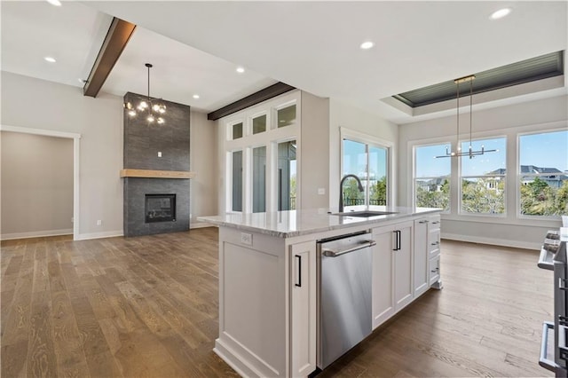 11606 S Zarda Dr, Olathe, KS 66061 - kitchen with a sink, a notable chandelier, a center island with sink, white cabinetry, and dishwasher