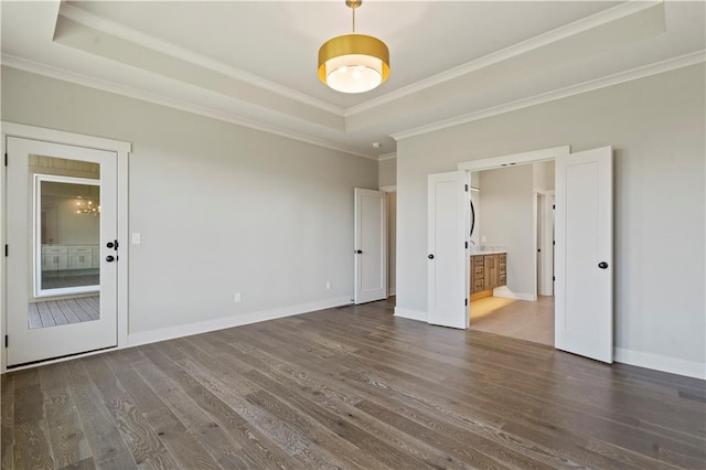 11606 S Zarda Dr, Olathe, KS 66061 - empty room with ornamental molding, baseboards, wood finished floors, and a tray ceiling