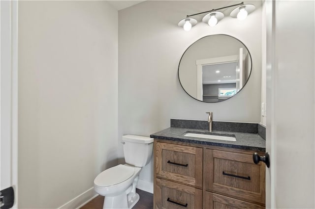 11606 S Zarda Dr, Olathe, KS 66061 - bathroom with toilet, vanity, and baseboards