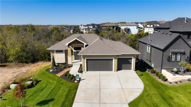 11606 S Zarda Dr, Olathe, KS 66061 - view of front of home with a residential view, a front yard, driveway, and a garage