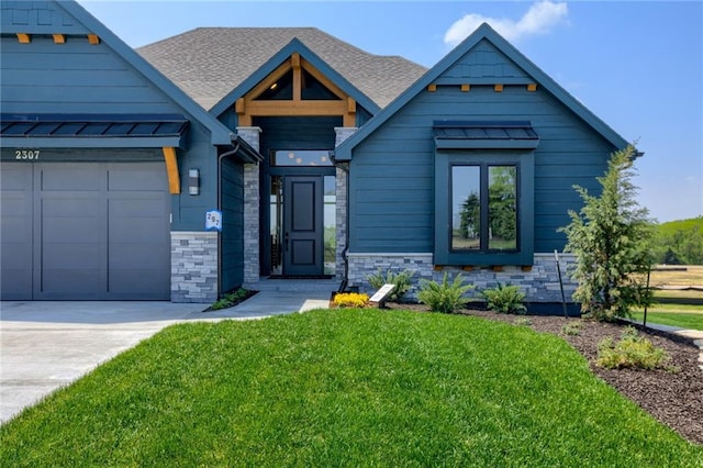 view of front facade with a front yard and a garage