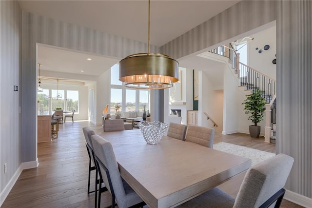 dining space featuring a notable chandelier and light hardwood / wood-style flooring