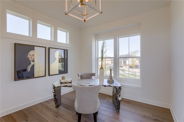 interior space with hardwood / wood-style floors, plenty of natural light, and a chandelier