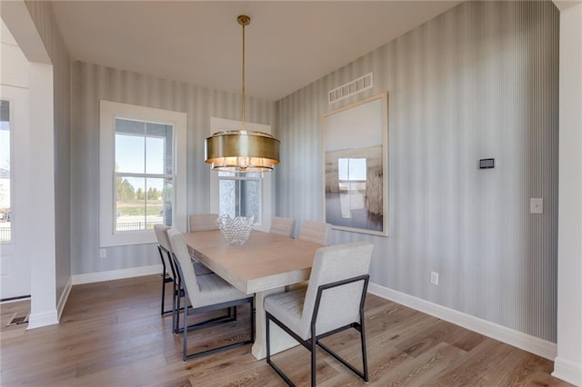 dining area with light hardwood / wood-style flooring