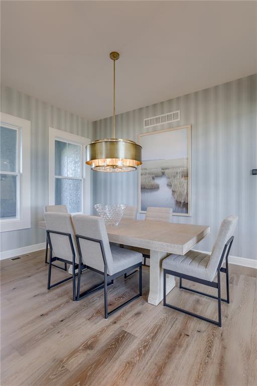 dining area with light hardwood / wood-style flooring