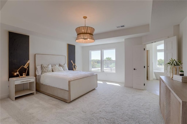 bedroom with light colored carpet