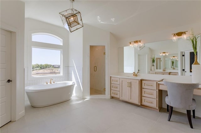 bathroom featuring tile flooring, shower with separate bathtub, vaulted ceiling, and oversized vanity