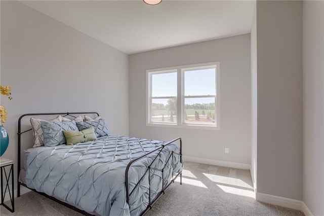 bedroom featuring light colored carpet