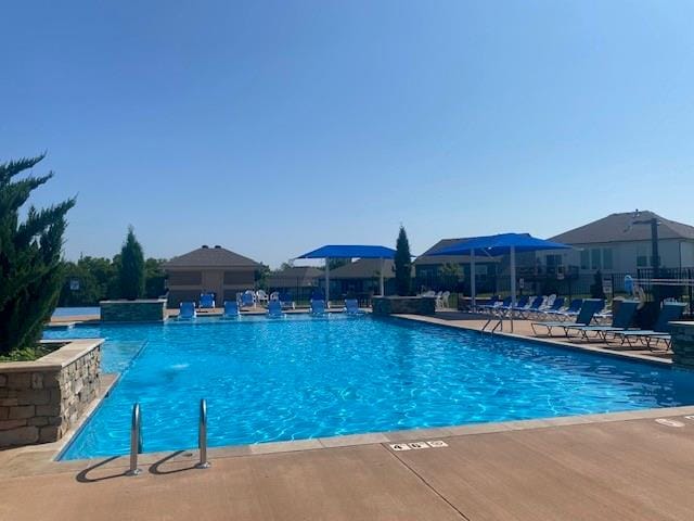 view of pool featuring pool water feature