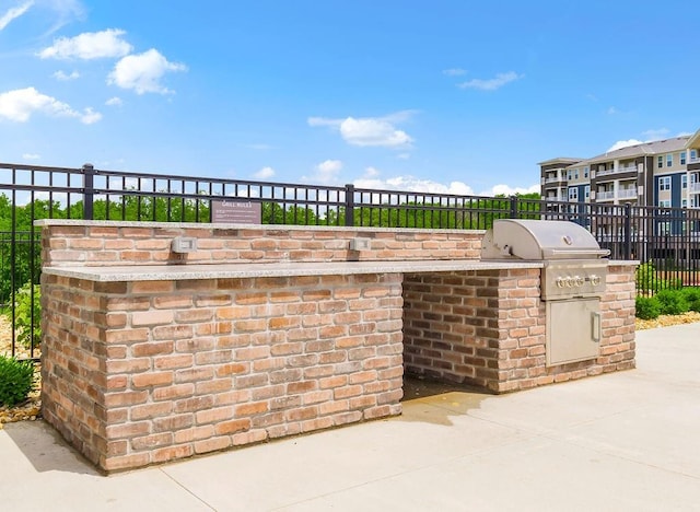 view of patio / terrace featuring area for grilling and an outdoor kitchen