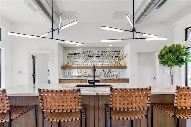 kitchen featuring a chandelier