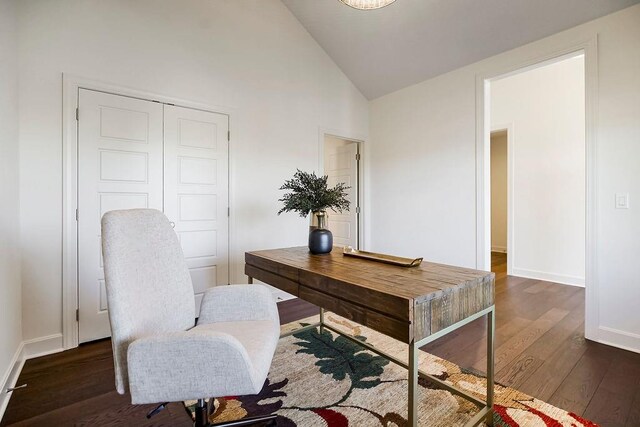 office area with dark wood-type flooring and high vaulted ceiling