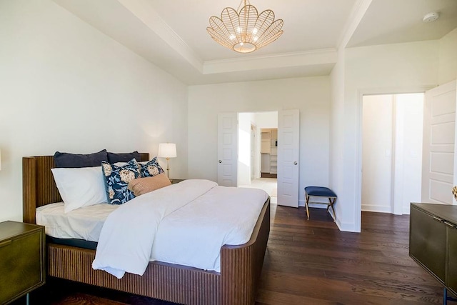 bedroom featuring an inviting chandelier and dark hardwood / wood-style floors