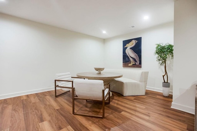 dining area with wood-type flooring