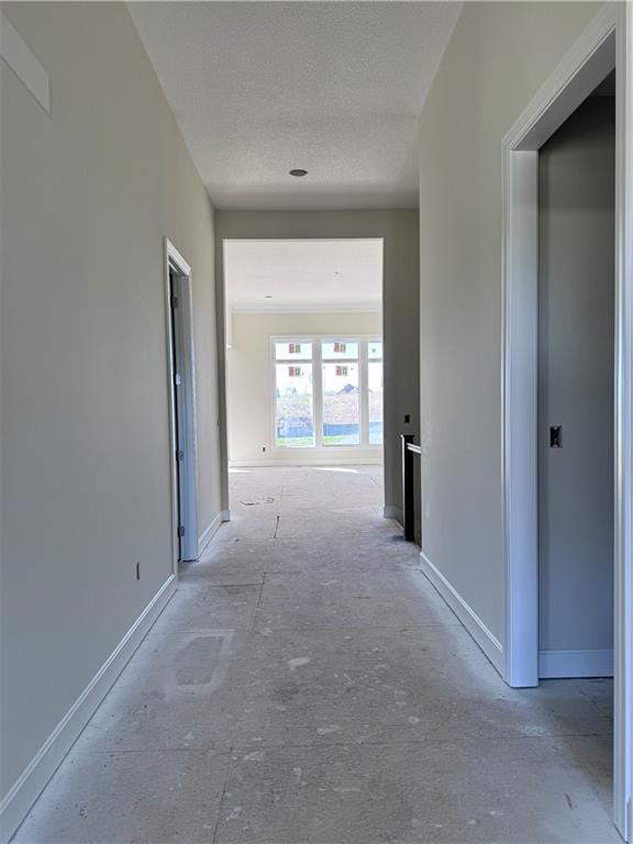 hallway featuring a textured ceiling