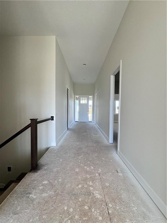 corridor featuring a textured ceiling