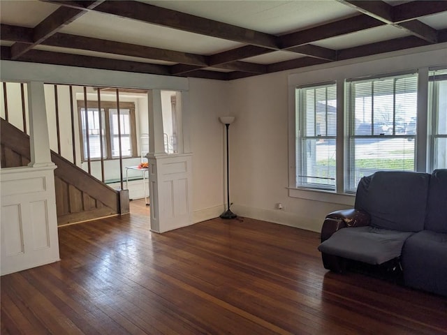 interior space featuring coffered ceiling, beamed ceiling, and dark hardwood / wood-style flooring