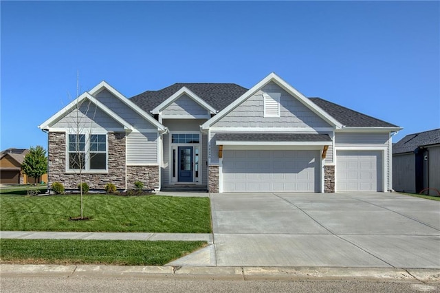 craftsman-style house with a garage and a front yard