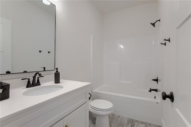 full bathroom with bathtub / shower combination, vanity, and toilet