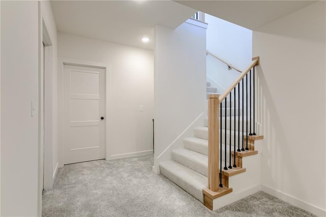 staircase with carpet flooring