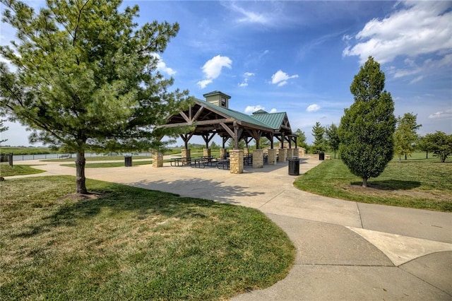 view of property's community with a gazebo and a yard