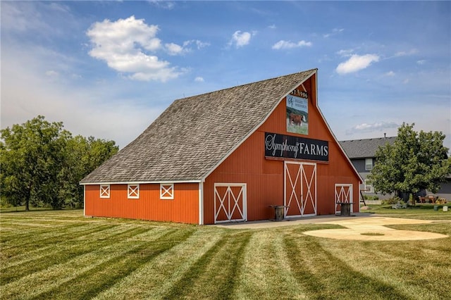 view of outbuilding with a lawn