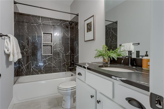 full bathroom with tiled shower / bath combo, vanity, and toilet