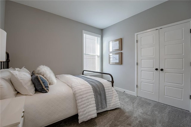 carpeted bedroom with a closet