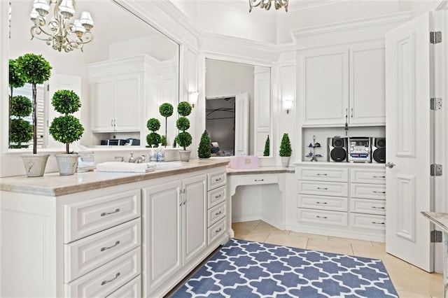 bathroom featuring vanity, tile patterned floors, and a notable chandelier