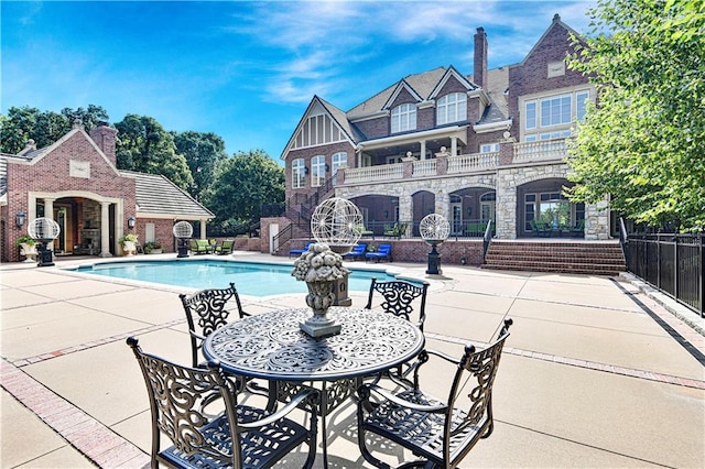 view of pool featuring a patio area