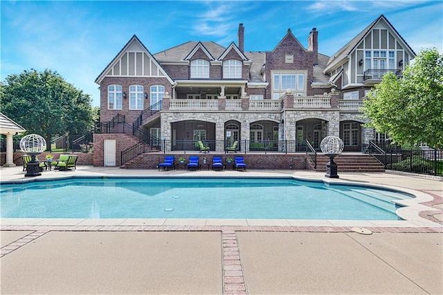 view of swimming pool with a patio