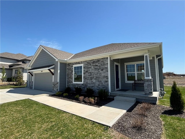 view of front of home featuring a front yard, a garage, and a porch