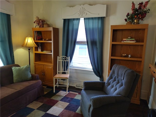 sitting room featuring dark tile flooring